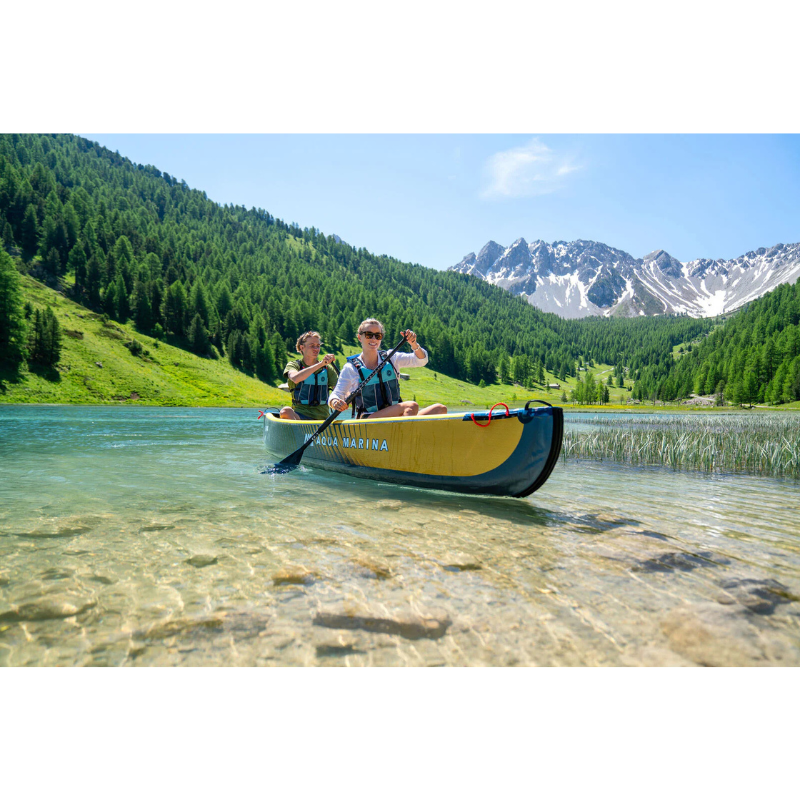 2 people riding Aqua Marina - Tomahawk AIR-C High-Pressure Speed Canoe for 3 Person