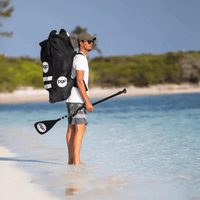 Thumbnail for A man with a POP iSUP Backpack with Wheels | Rolling Inflatable Paddle Board Travel Bag