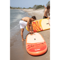 Thumbnail for A paddler attaching a leash with Aqua Marina 12'0