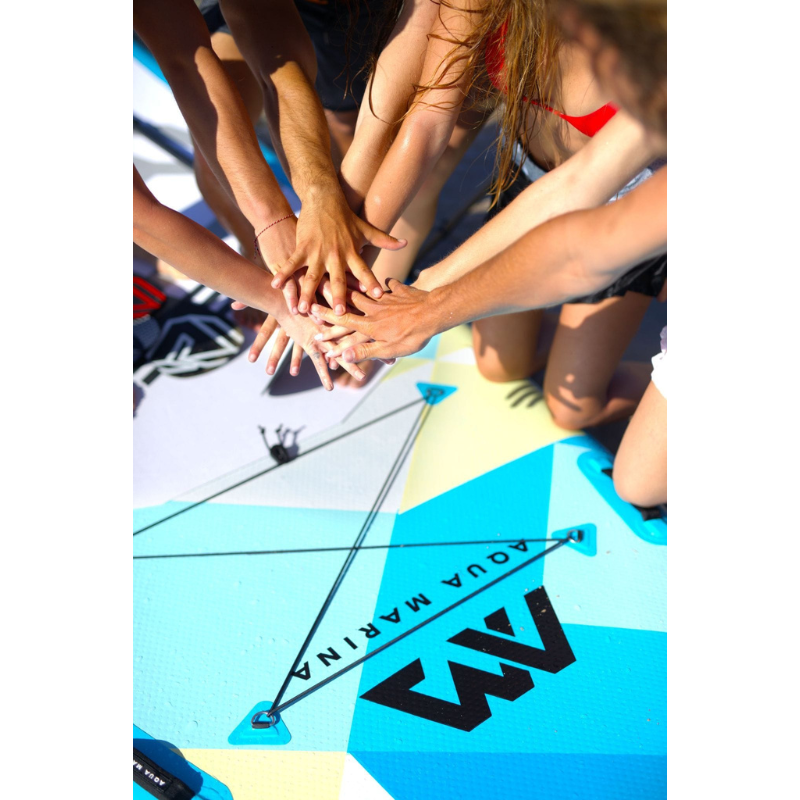 a group of people with a Aqua Marina 18'1" Mega Inflatable Paddle Board