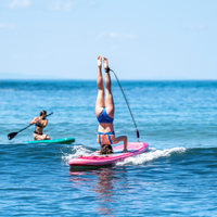 Thumbnail for Aqua Marina 10’2” Coral 2023 Inflatable Paddle Board All-Around Advanced SUP Raspberry in action