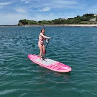 Thumbnail for Aqua Marina 10’2” Coral 2023 Inflatable Paddle Board All-Around Advanced SUP Raspberry in the water